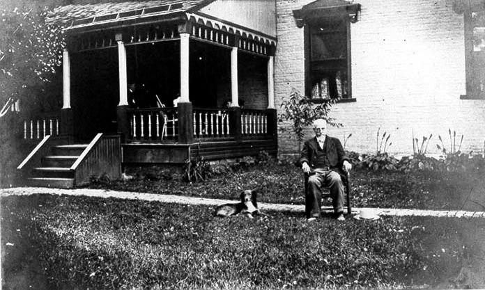Photograph of Anthony Weaver in front of the Buttles-Pinney-Brown House