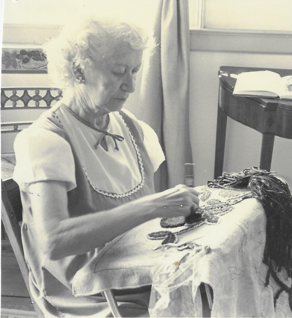 Photograph of Bonna Stone Tufting a Rug