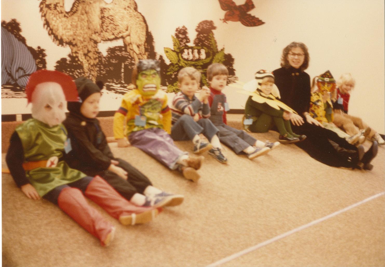 Photograph of Librarian Rachel Alexander with Children at a Halloween Storytime