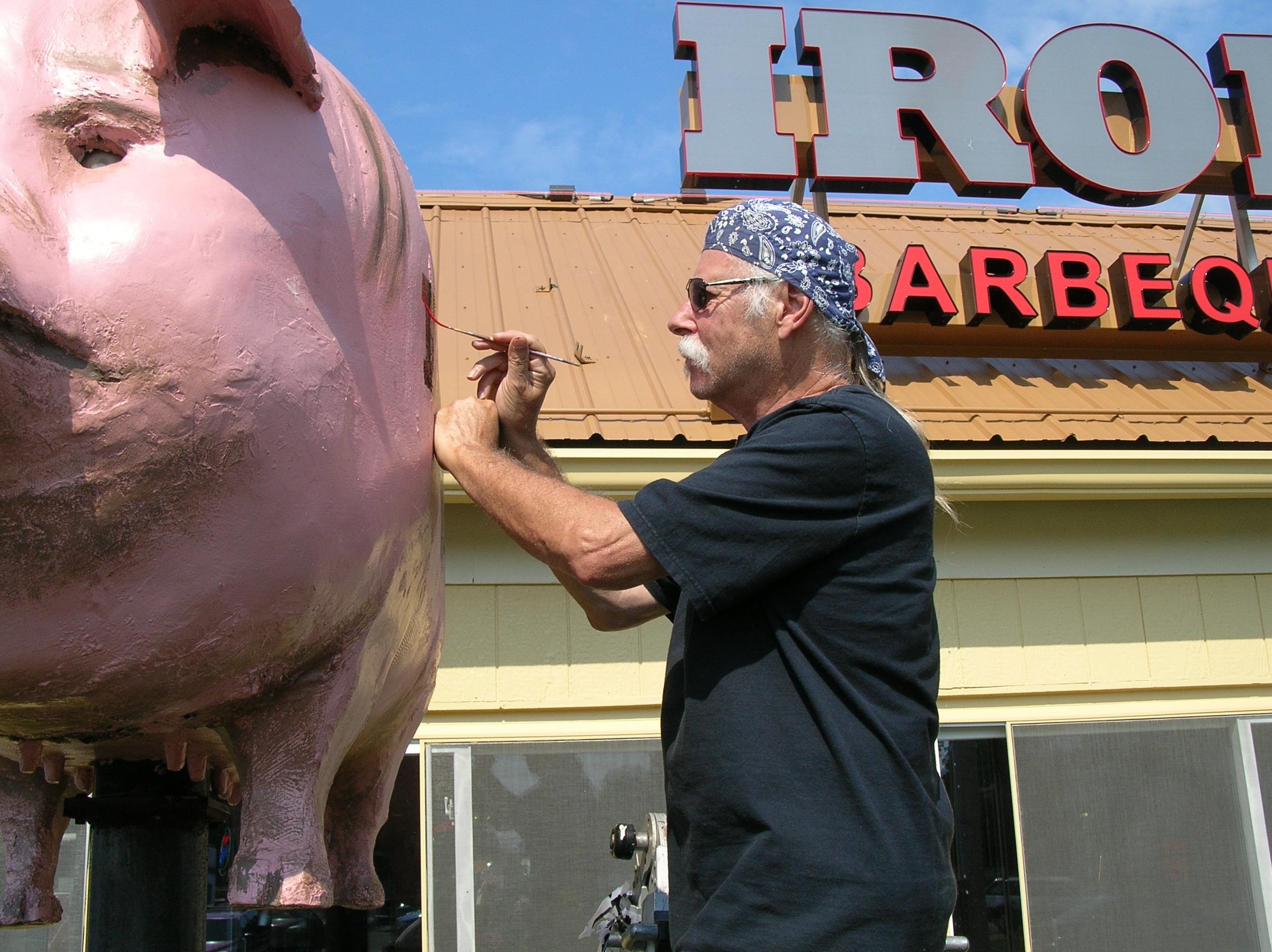 William (bc) (Bill) Collins Painting the Iron Grill Pig