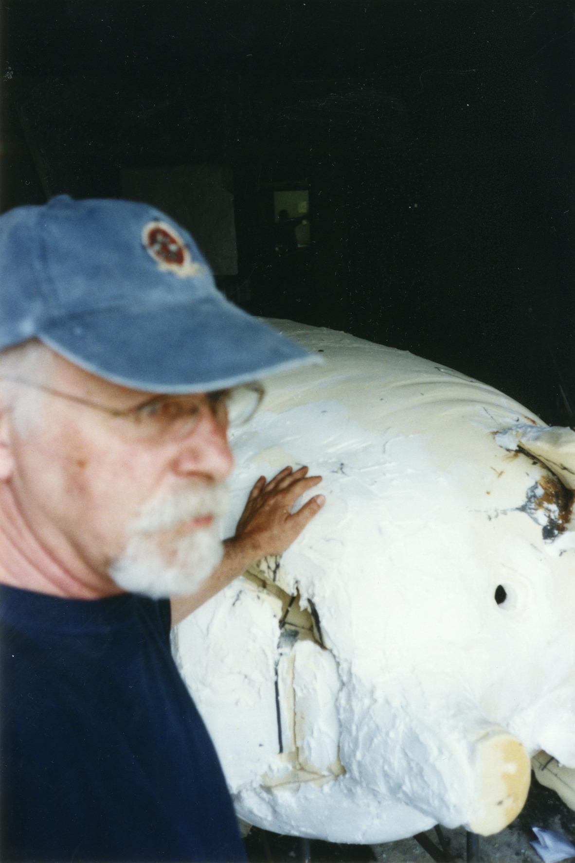 William (bc) (Bill) Collins Sculpting the Pig Iron BBQ Pig Statue