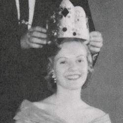 Young woman being crowned queen in 1958