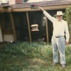 Person Standing at Bird Feeder in front of 312 E. South Street