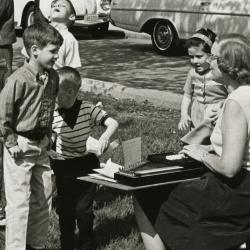 Photograph of Children and Adult with Autoharp Outside at the Worthington Public Library's National Library Week Celebration, 1968