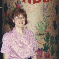 Photograph of Jo Osborne with "Red Hot Readers" Pillar