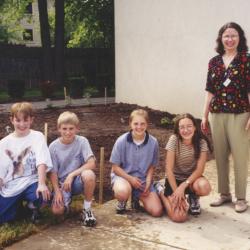 Photograph of Rachel Alexander with Children in Storybook Garden at Northwest Library