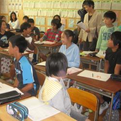 Photograph of teachers and students in a school classroom in Sayama, Japan