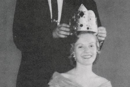 Young woman being crowned queen in 1958