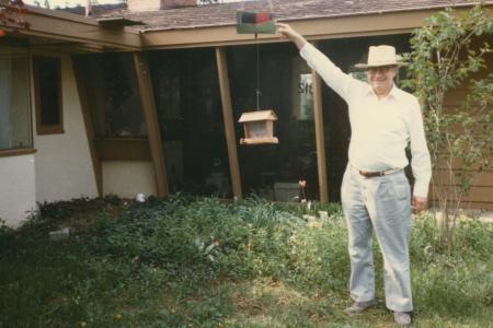 Person Standing at Bird Feeder in front of 312 E. South Street