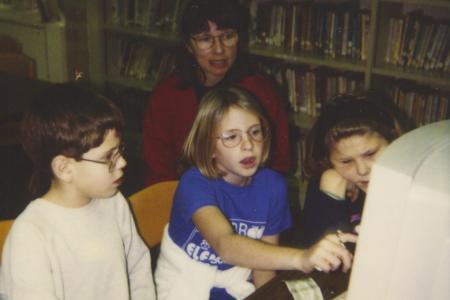 Photograph of Librarian Rachel Alexander with Children Using Computer, Old Worthington Library